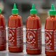 Huy Fong sriracha bottles with green caps